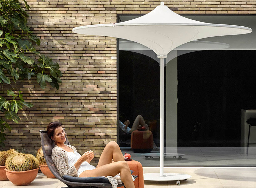 belgium-designed hulasol is a sun umbrella by day and an outdoor lamp by night
