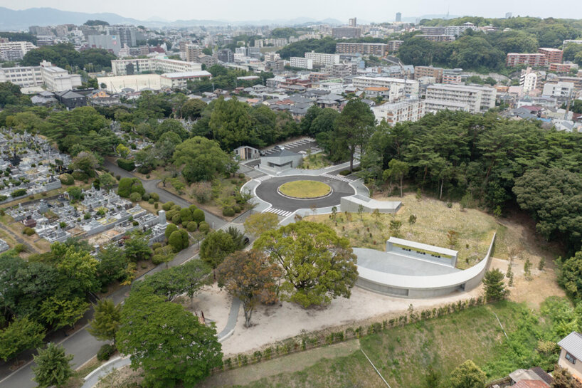 KINO architects completes japanese cemetery with arc-shaped plaza for contemplation