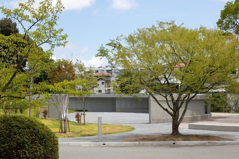 KINO architects completes japanese cemetery with arc-shaped plaza for contemplation
