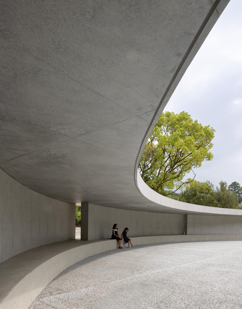 KINO architects completes japanese cemetery with arc-shaped plaza for contemplation