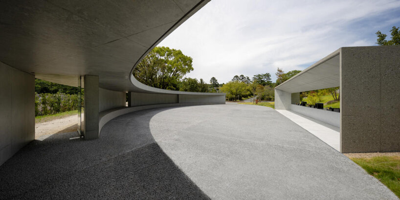 KINO architects completes japanese cemetery with arc-shaped plaza for contemplation