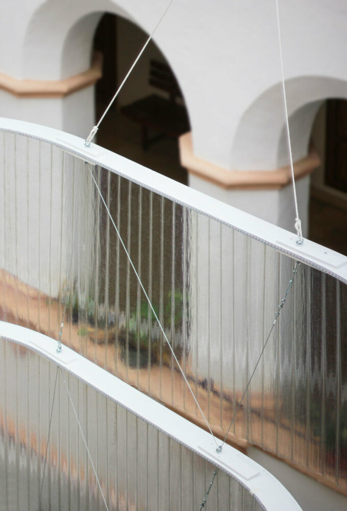 corrugated translucent fiberglass membrane covers the rings