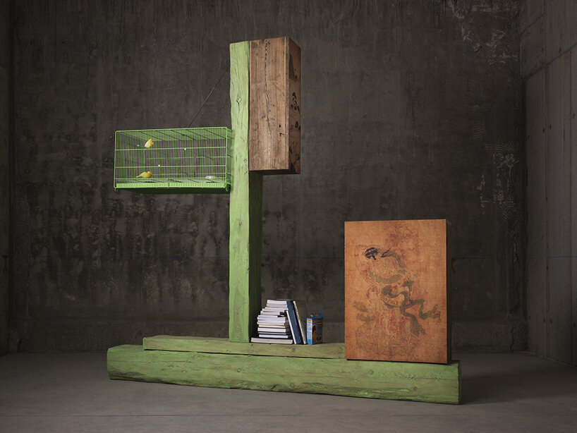 andrea branzi's totem-like grandi legni sculptures safeguard milan's nilufar depot