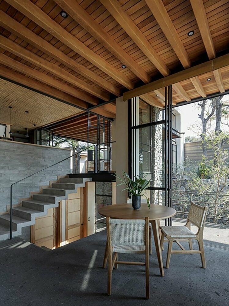 dining room next to a concrete staircase