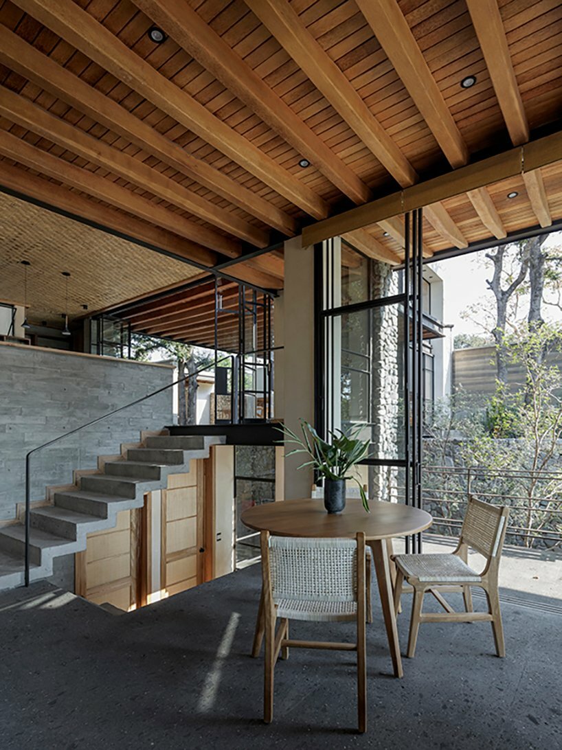 dining room next to a concrete staircase