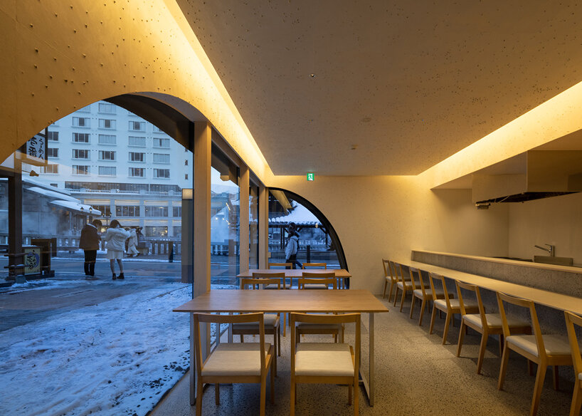kengo kuma adds local stone to hot spring inn in kusatsu, japan