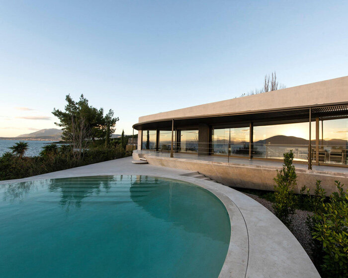 tense architecture network adds circular pool to concrete island residence in greece