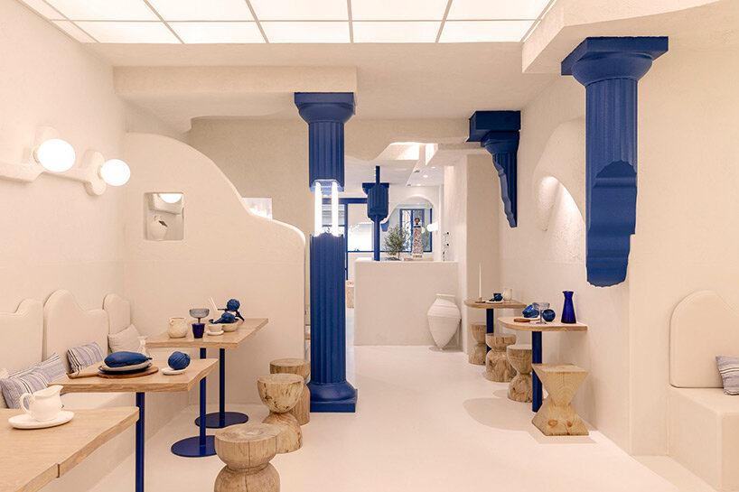 blue 3D printed ancient columns pop into masquespacio's greek restaurant interior in valencia