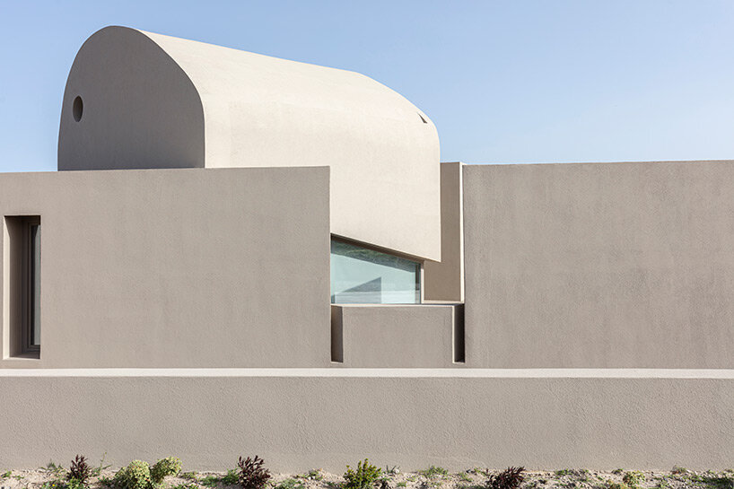 volcanic rock-like forms and earthy tones build kapsimalis architects' house in santorini