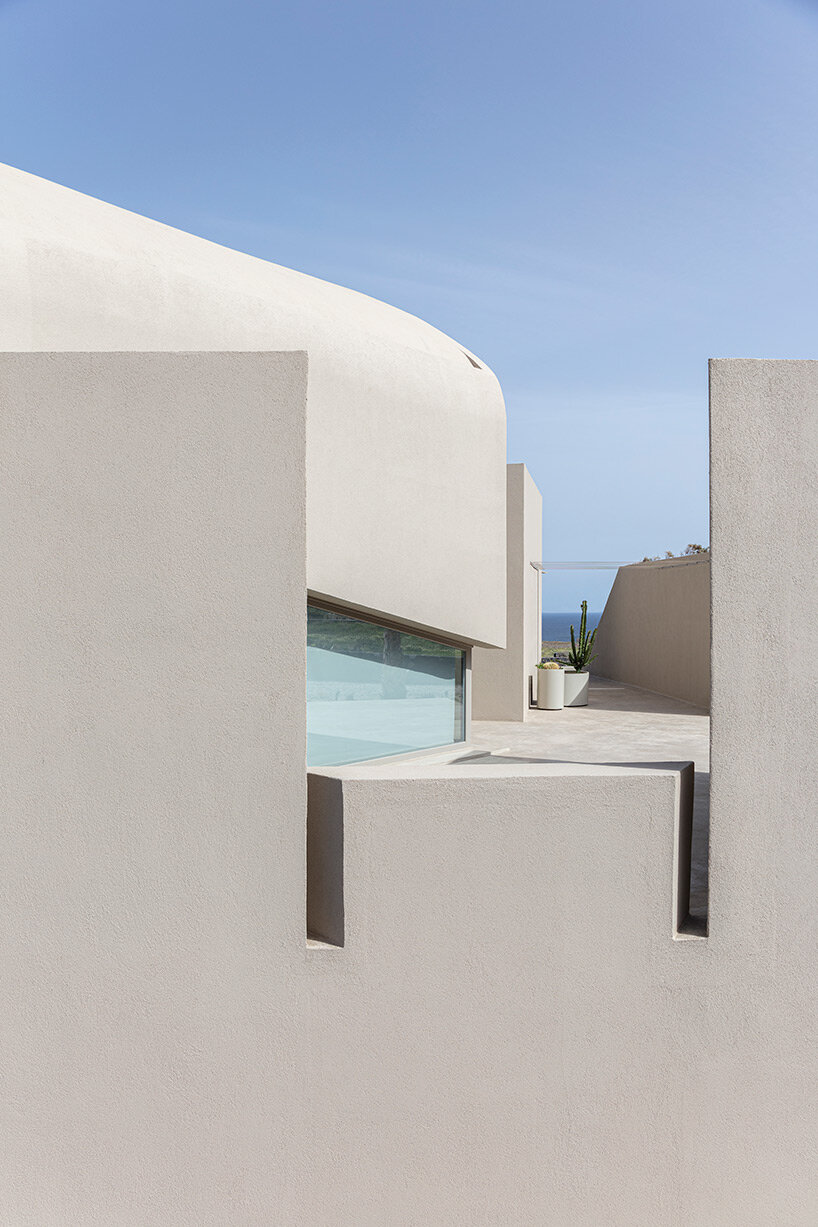 volcanic rock-like forms and earthy tones build kapsimalis architects' house in santorini