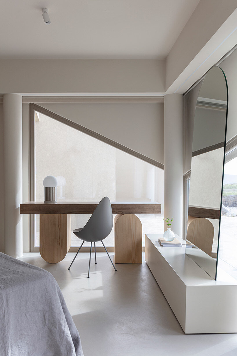 volcanic rock-like forms and earthy tones build kapsimalis architects' house in santorini