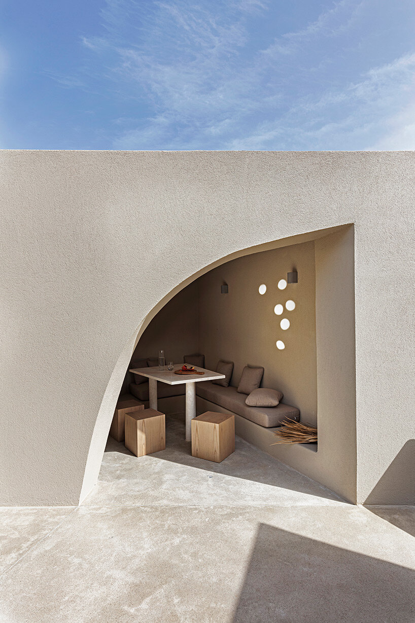volcanic rock-like forms and earthy tones build kapsimalis architects' house in santorini
