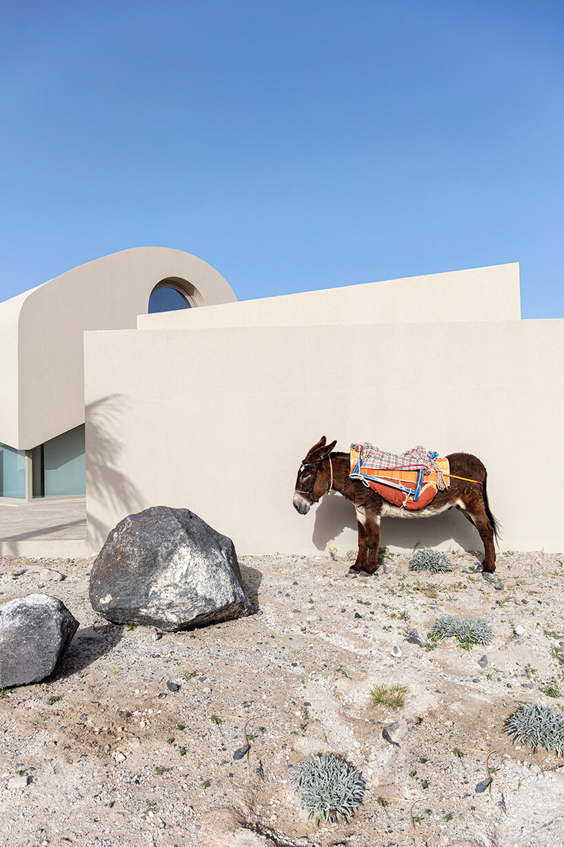 volcanic rock-like forms and earthy tones build kapsimalis architects' house in santorini