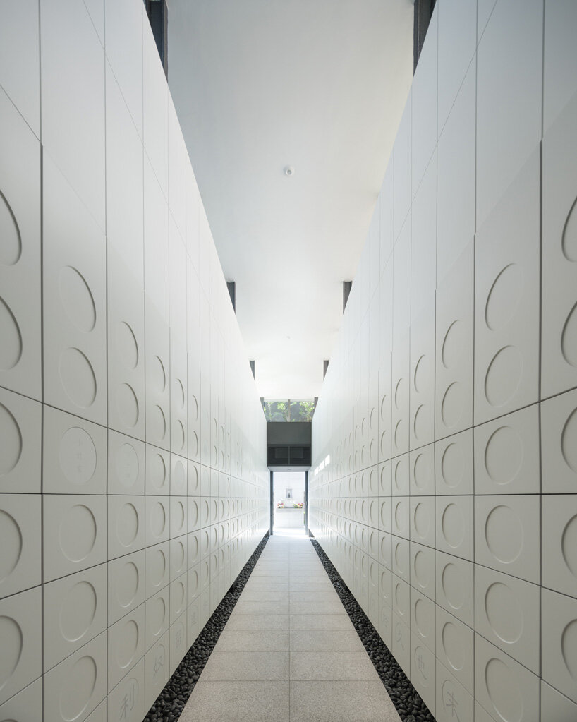 black tones unify this japanese temple's ossuary and tree burial facility by love architecture