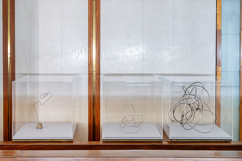 lucio fontanta and antony gormley's sculptures meet inside carlo scarpa's negozio olivetti in venice