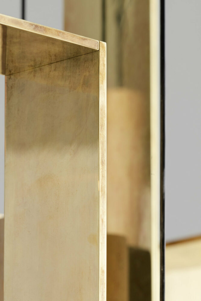 light reflected on the polished brass creates warm, visual complexity that gives character to the space