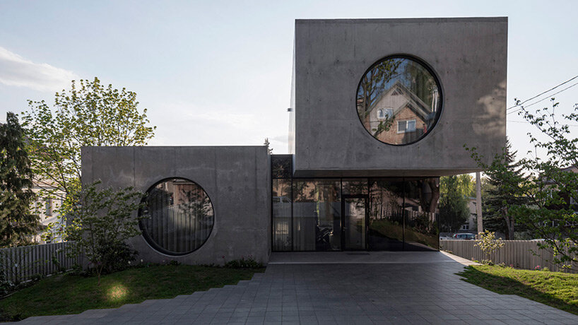 g.natkevicius & partners has completed a monumental two-story residence with a basement right in the heart of kaunas, lithuania.