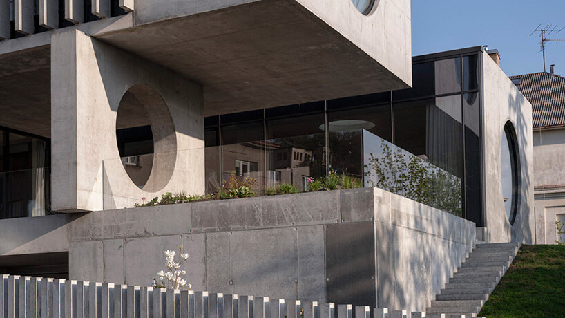 g.natkevicius & partners has completed a monumental two-story residence with a basement right in the heart of kaunas, lithuania.