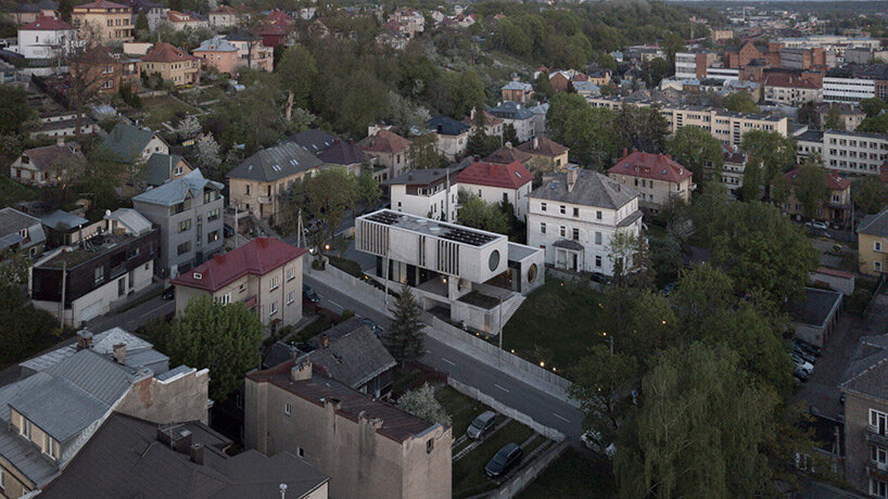 g.natkevicius & partners has completed a monumental two-story residence with a basement right in the heart of kaunas, lithuania.