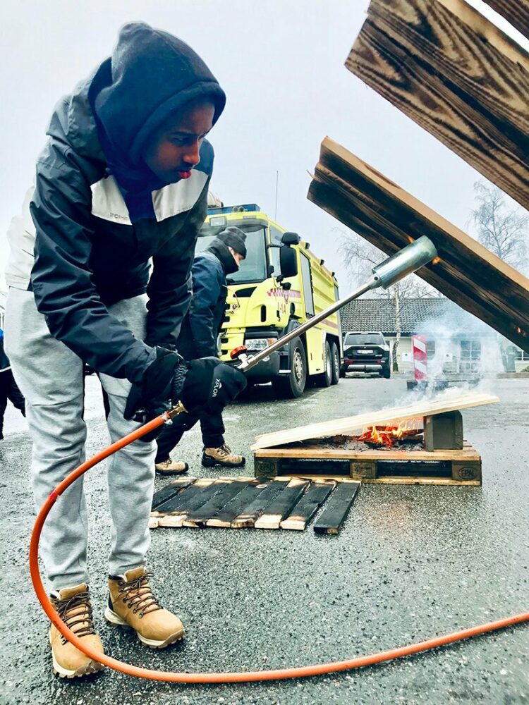 10th grade kids at the middle school across the street from the site learned the old technique of burning wood to make the periscope weather resistant