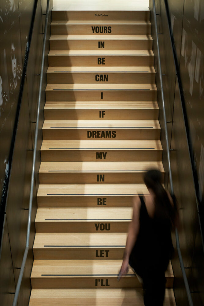 a Bob Dylan quote lines the stairway
