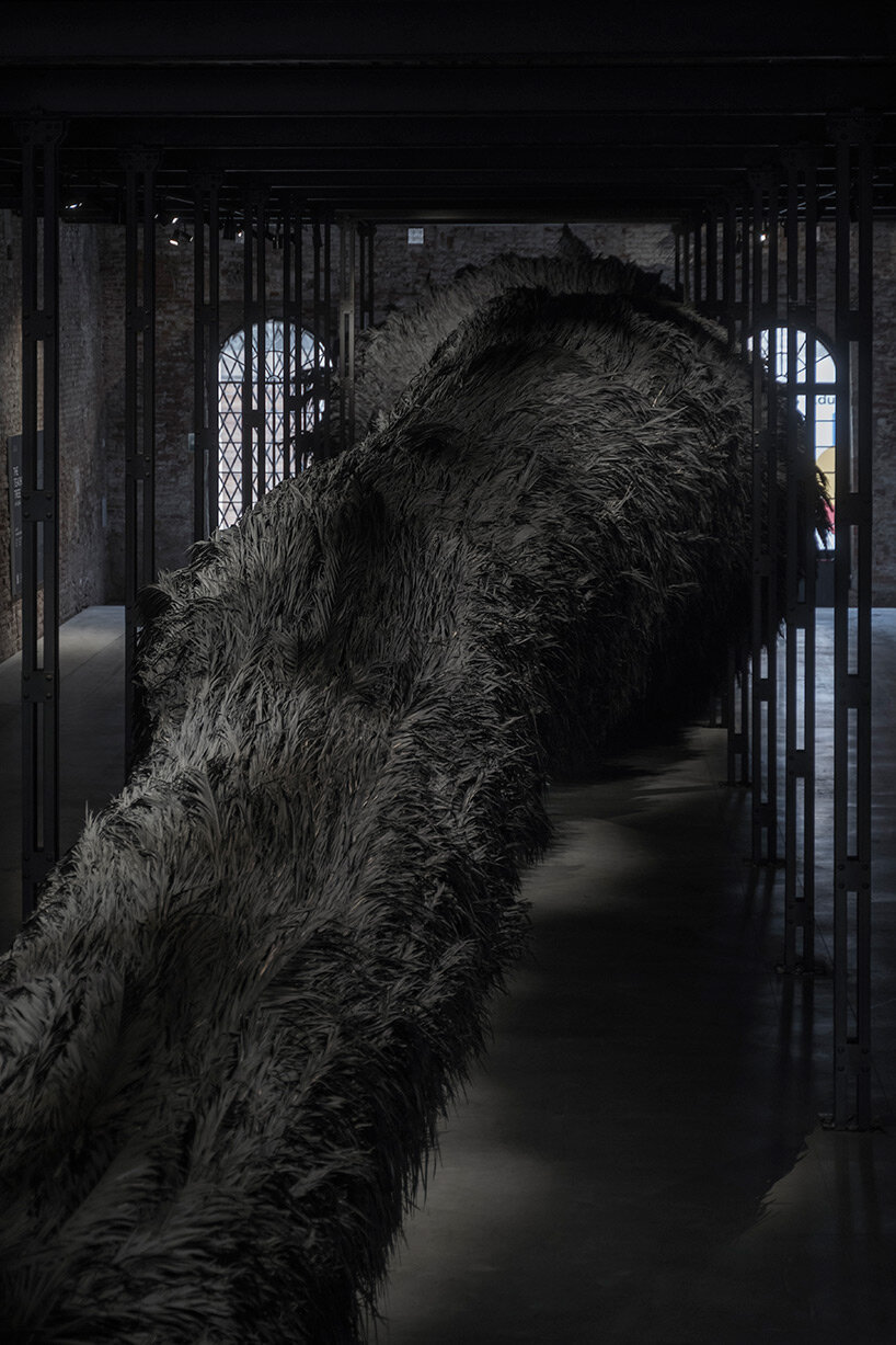 saudi arabia pavilion presents enigmatic 40-meter-long palm frond installation at venice art biennale
