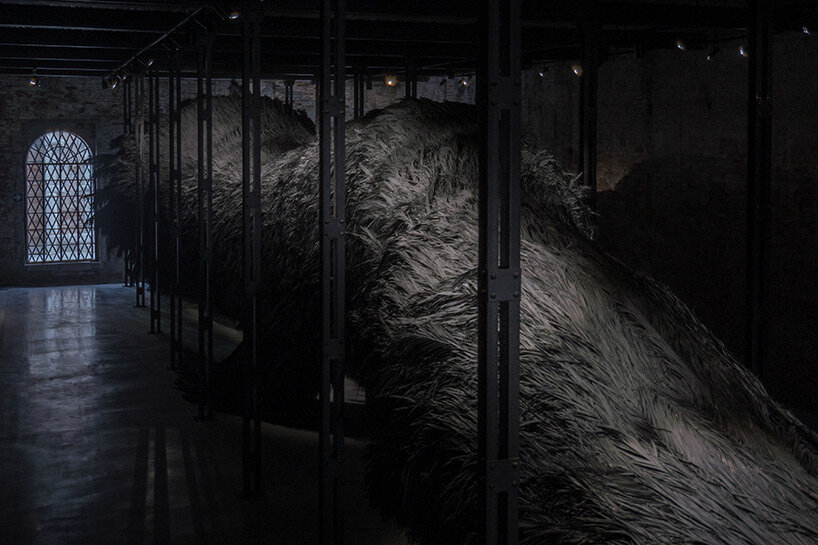 saudi arabia pavilion presents enigmatic 40-meter-long palm frond installation at venice art biennale