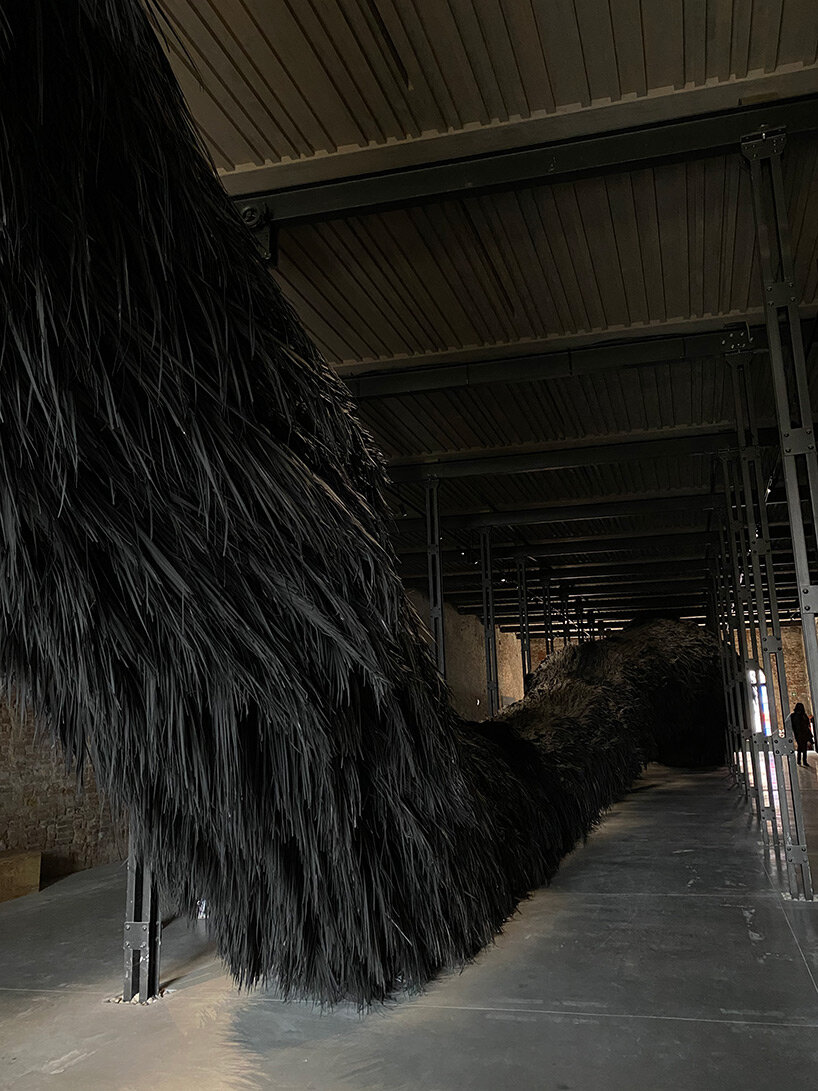 saudi arabia pavilion presents enigmatic 40-meter-long palm frond installation at venice art biennale