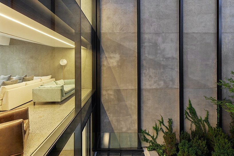 the wide shallow spaces overlooking open garden provide striking progression through the retail showrooms