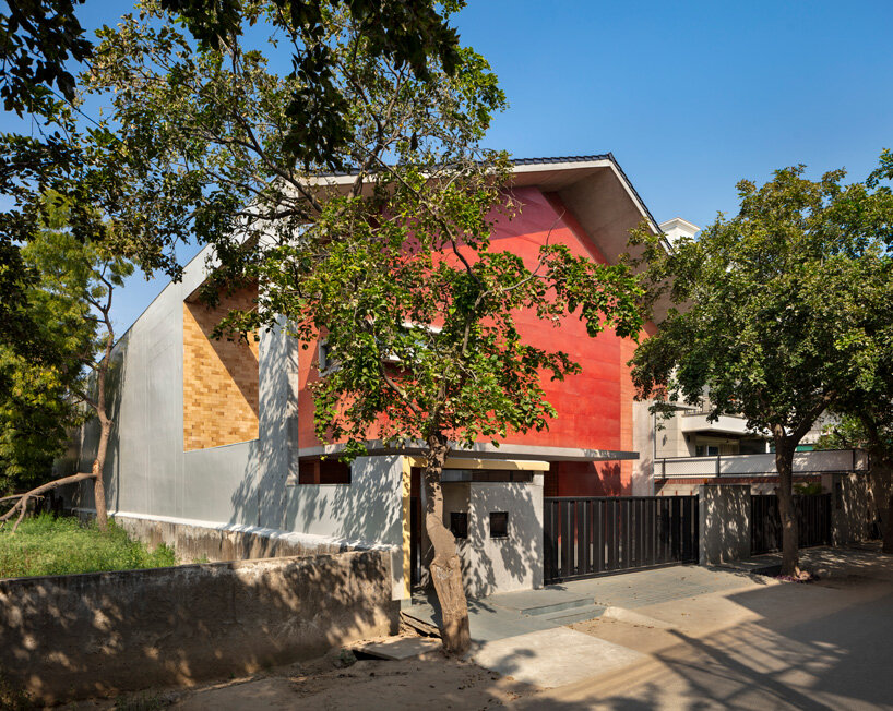 anagram architects infuses red concrete house in india with whimsical playfulness