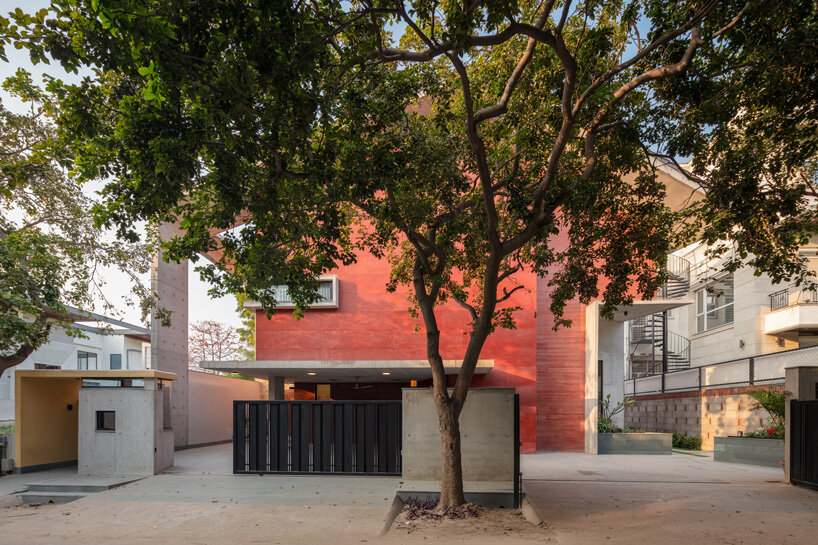 anagram architects infuses red concrete house in india with whimsical playfulness