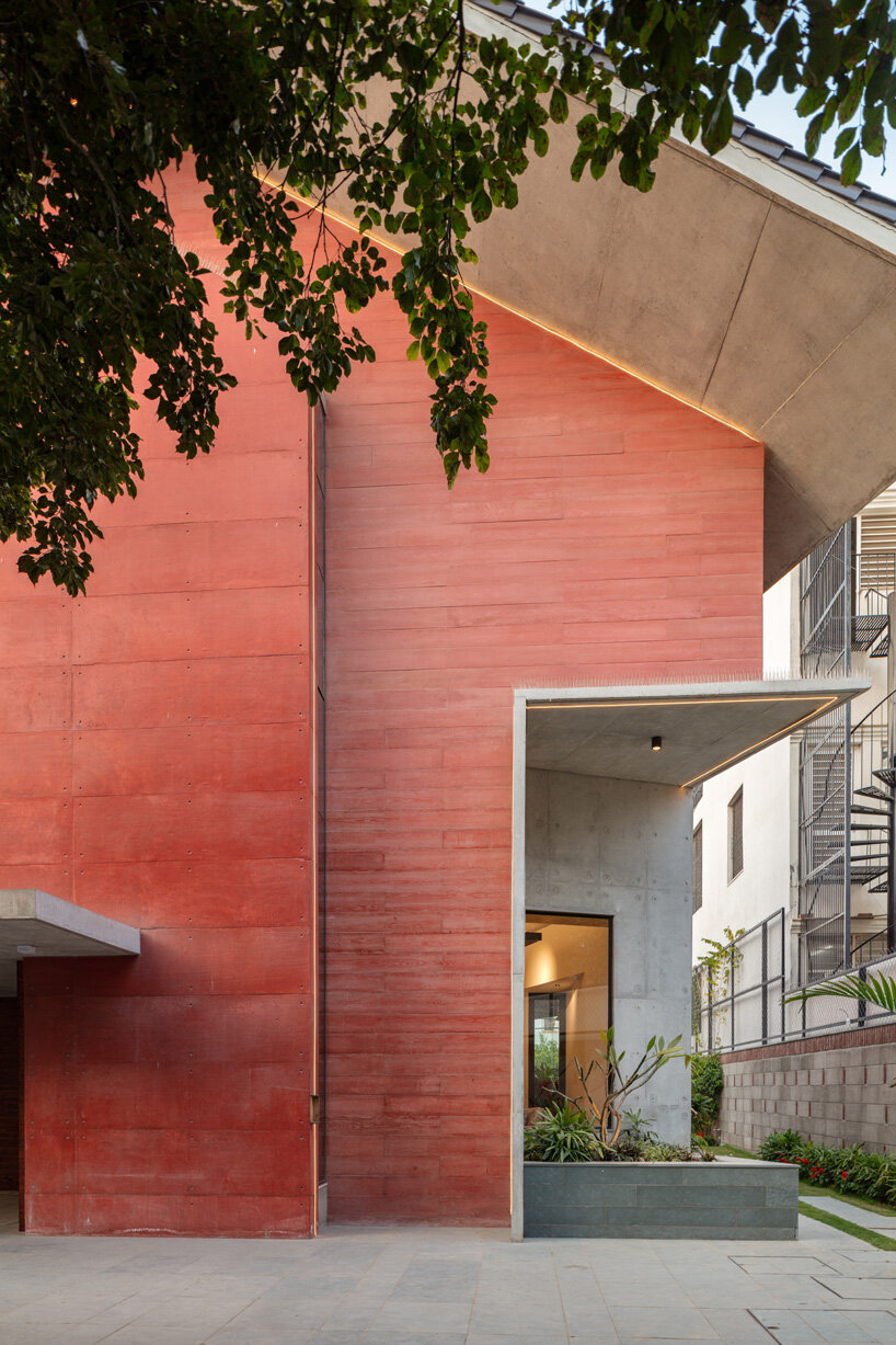 anagram architects infuses red concrete house in india with whimsical playfulness