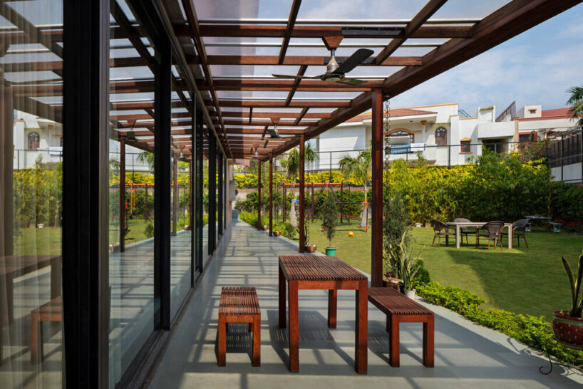 the garden features a long verandah shaded by a pergola