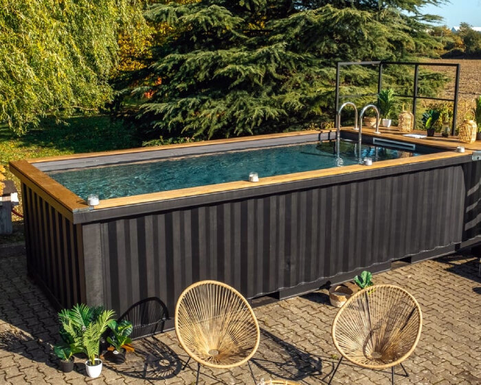 french company turns shipping containers into durable, low-maintenance swimming pools