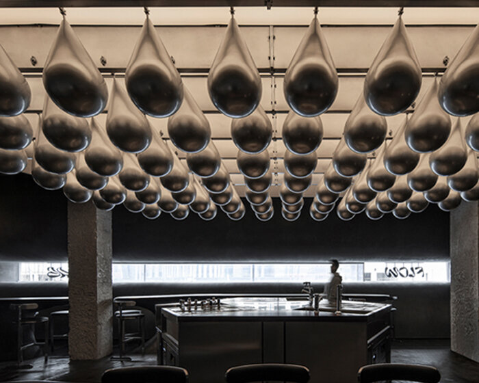 eye-catching waterdrop installation adorns the ‘flow bar & lab’ in china