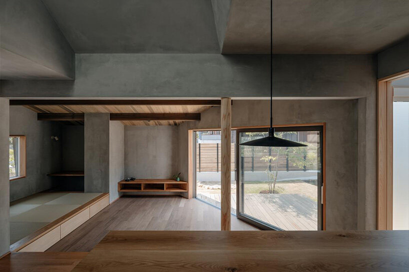hearth architects blends concrete with timber touches within minimalistic house in japan