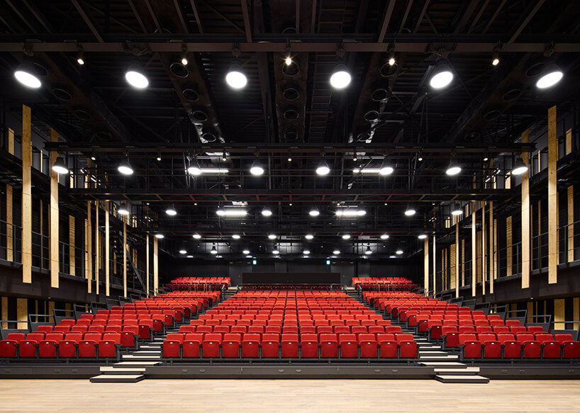 kengo kuma wraps yokohama campus building in a facade of folding timber panels