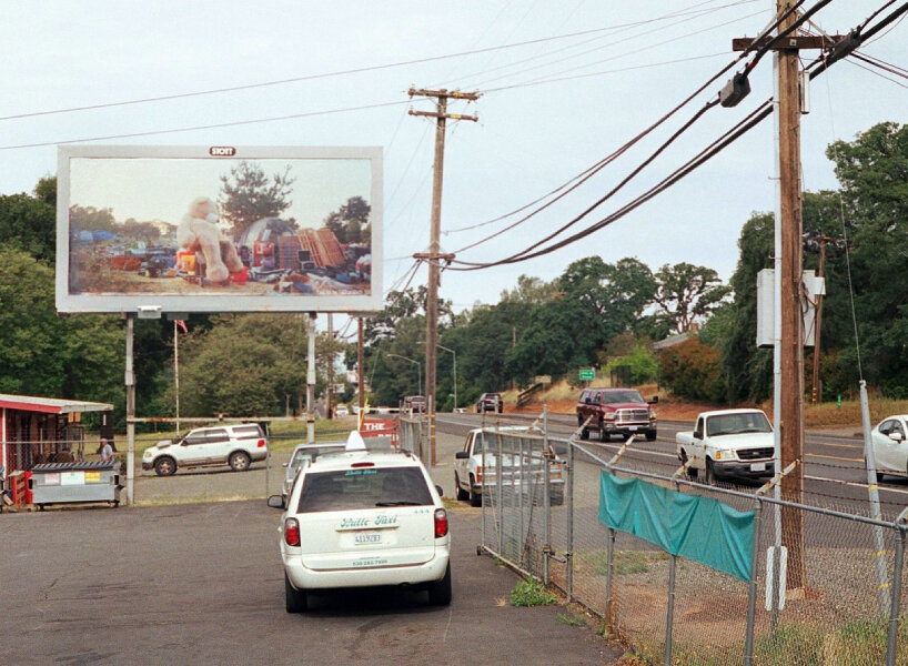 photographer puts up billboards to show drought, homelessness, and wildfires in california