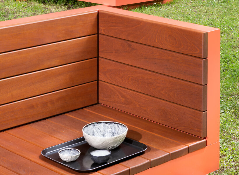 andrea zittel created five bench sculptures in soft red to gather people at esters garden house