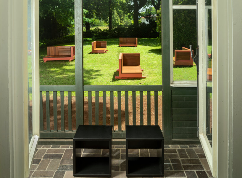andrea zittel created five bench sculptures in soft red to gather people at esters garden house