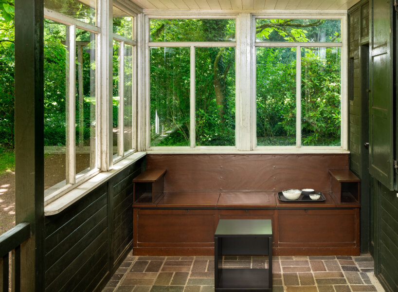 andrea zittel created five bench sculptures in soft red to gather people at esters garden house