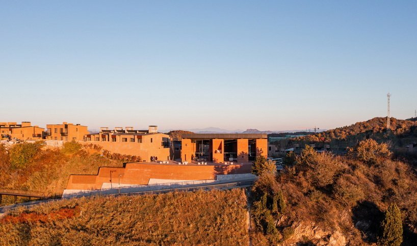 the main building integrates with the surrounding environment