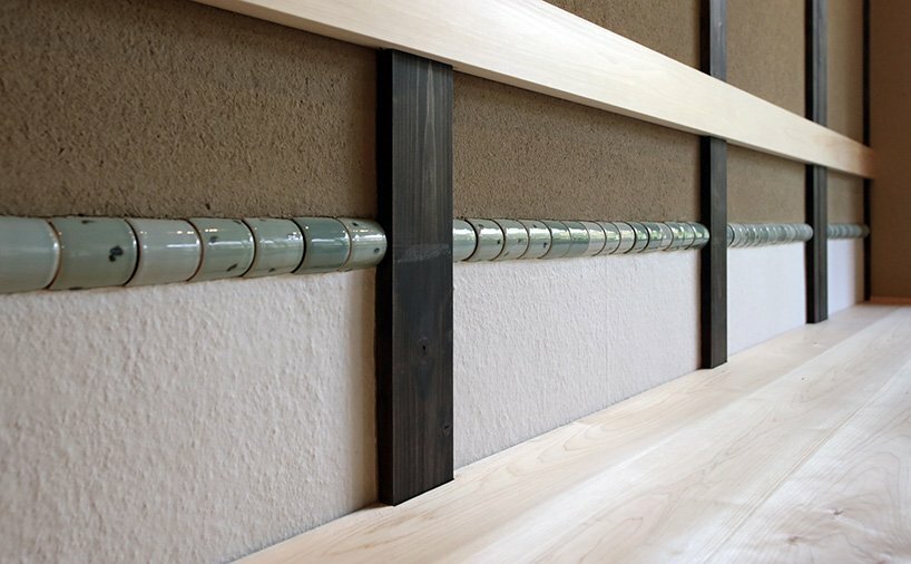 cylinder containers for tea cloths in walls