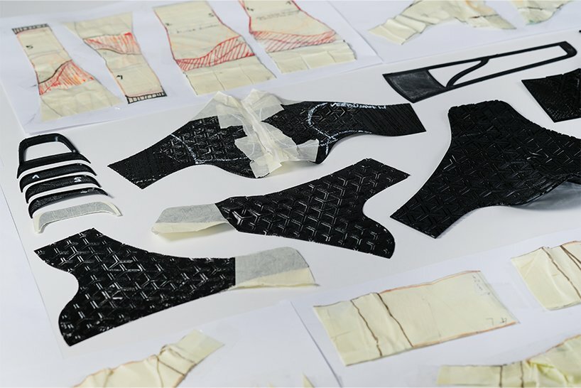 the 3D printed elements are glued together then stitched onto the existing sole