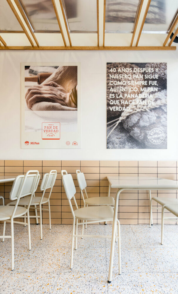 concèntrico envelops mi pan bakery with hanging metallic trays and pinewood in mexico