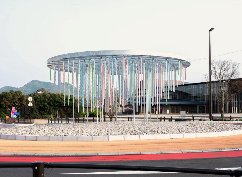 roundabout installation by takao shiotsuka atelier drips like paint via colored steel pipes