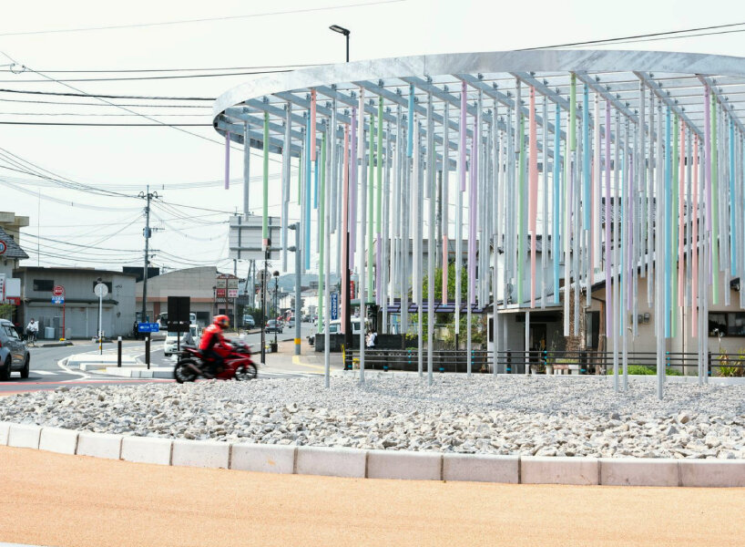 roundabout installation by takao shiotsuka atelier drips like paint via colored steel pipes