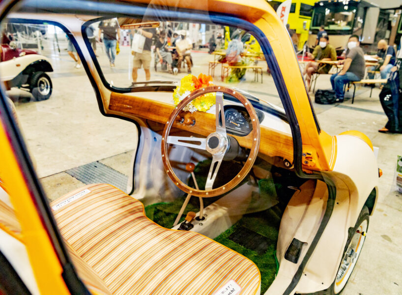 custom subaru 360 beach van oozes summer vibes with its orange hood and retro seats