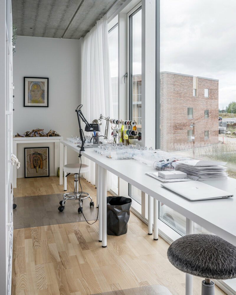 BIG’s modular housing spirals around central pond in danish sustainable suburb