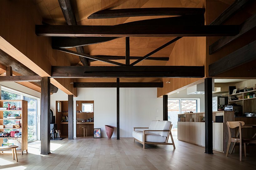 part of the ceiling was finished with dark-colored lauan plywood to match the existing structural materials
